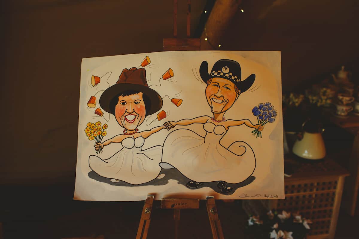 Two Brides caricature drawing highlighting their personalities - Gay Wedding Ideas