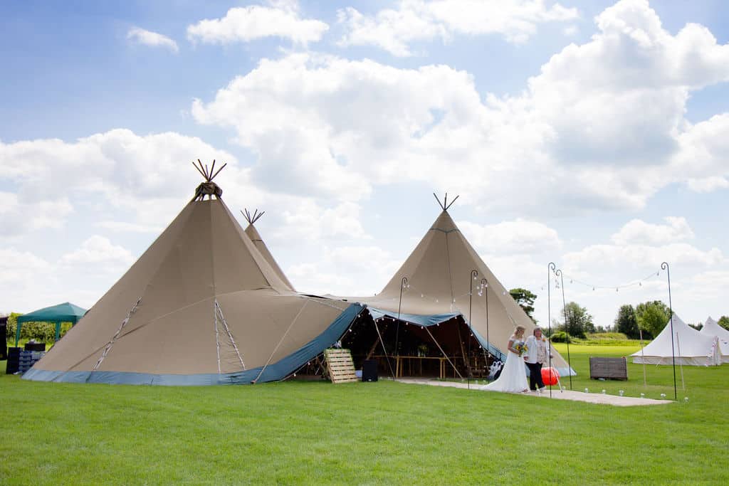 Cattows Farm Wedding with Three Giant Hat Tipis, Bride Walking down Tipi walkway to ceremony