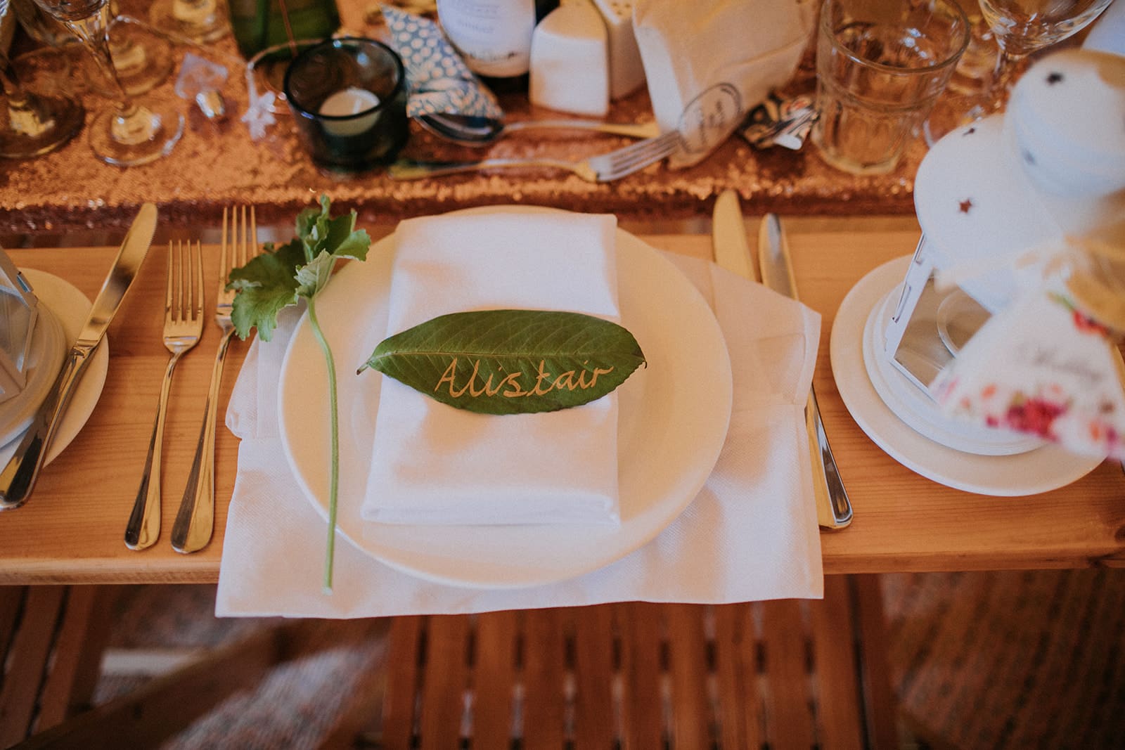 Hand written leaf as place name setting. Cattows Farm wedding with sami tipi